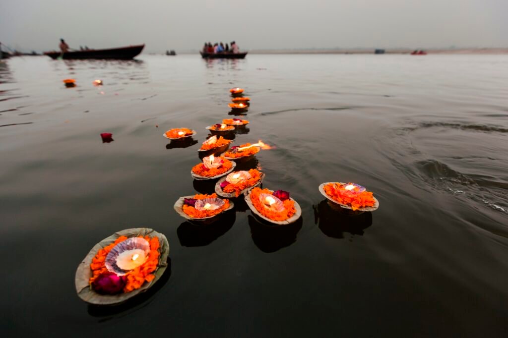 Candles floating in the Ganges River, Varanasi, India