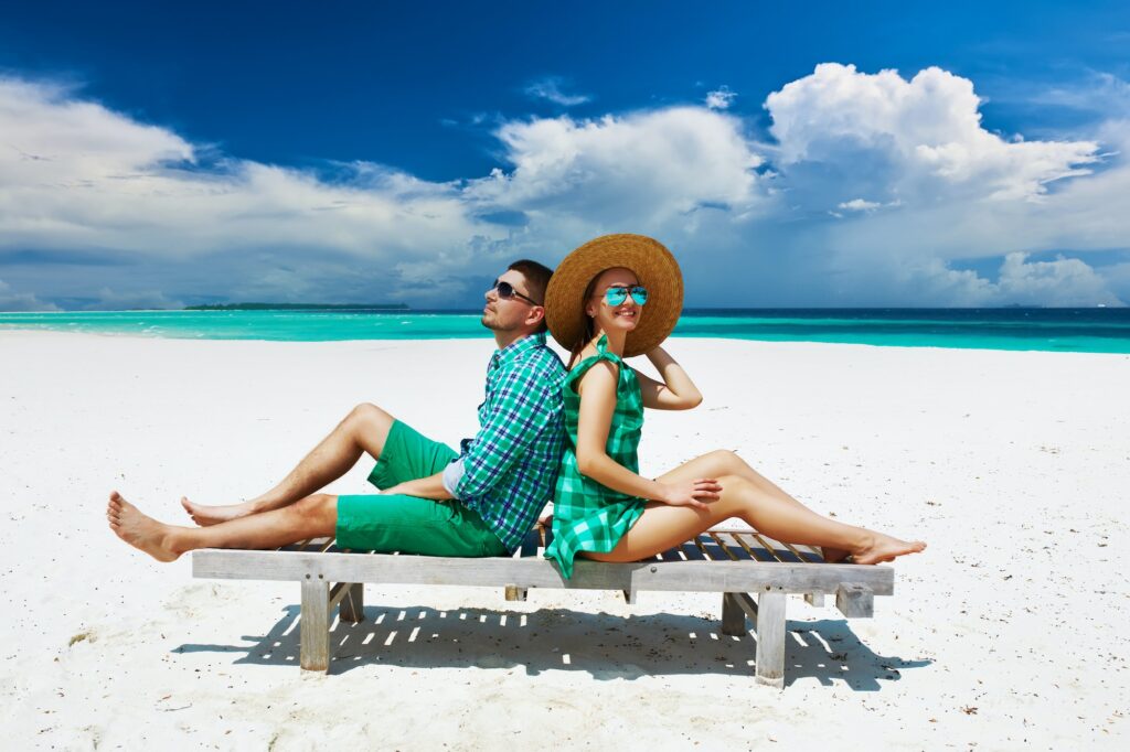 Couple in green on a beach at Maldives