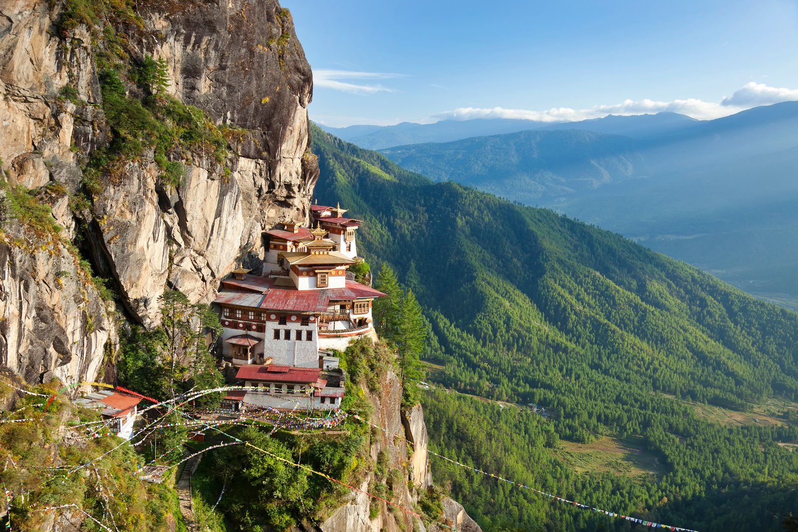 Himalayan Buddhist temple complex perched on a vertical rockface.